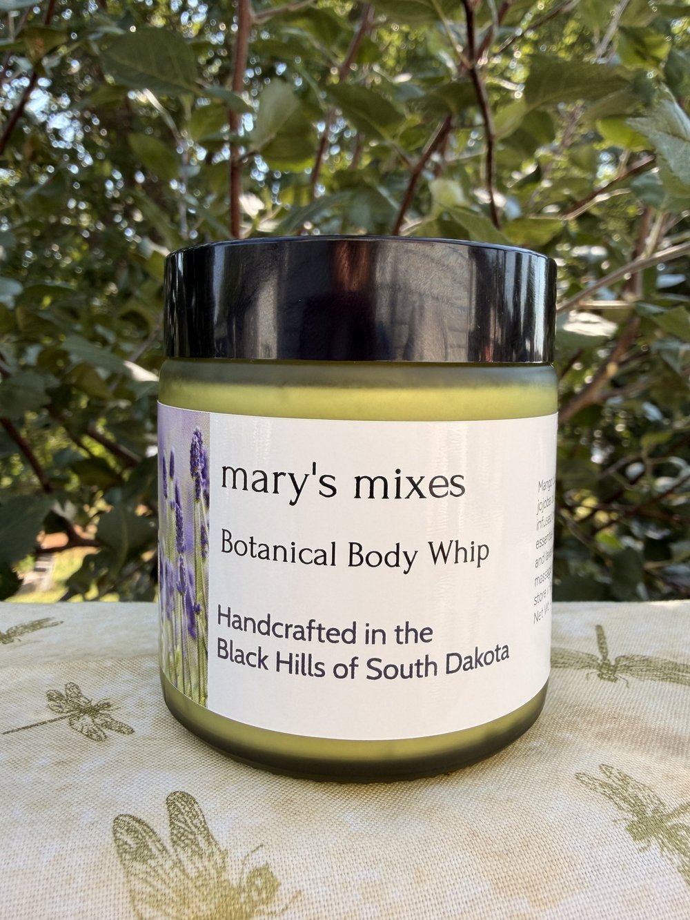 Mary’s Mixes Botanical Body Whip in a jar with a black lid